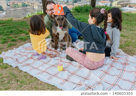 Children Celebrating a Dog's Birthday Picnic in the Park Children Celebrating a Dog's Birthday Picnic in the Park 140603303