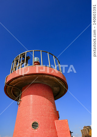 Close up Shimonoseki Tobamamachi Breakwater Lighthouse, A small lighthouse at the entrance to Shimonoseki Arcaport, Japan. Close up Shimonoseki Tobamamachi Breakwater Lighthouse, A small lighthouse at the entrance to Shimonoseki Arcaport, Japan. 140603391