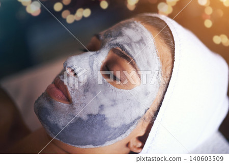 Woman, closeup with face mask and beauty for skincare, charcoal or clay for treatment and dermatology at day spa. Detox for skin, healthy and wellness with cosmetics, calm and self care with facial 140603509