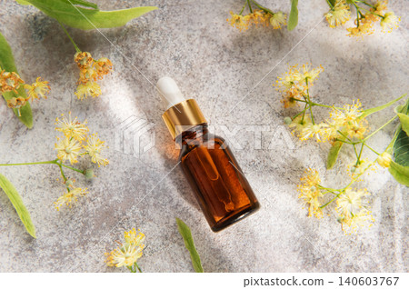 Linden flower essential oil in dropper bottle for skincare 140603767