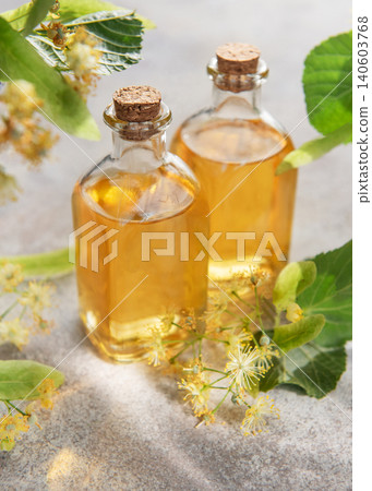 Linden flower essential oil in glass bottles 140603768
