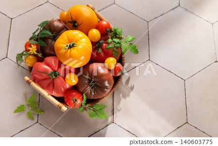 Heirloom tomatoes in basket showing harvest freshness 140603775