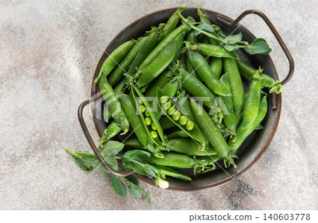 Fresh green peas in rustic bowl healthy food concept Fresh green peas in rustic bowl healthy food concept 140603778