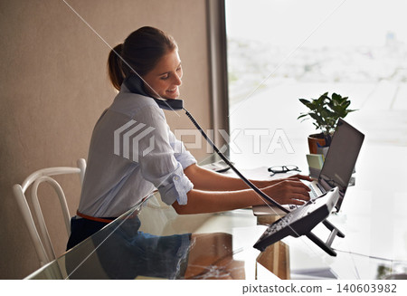 Businesswoman, laptop and talking on phone professional, formal clothes and working in office. Female person, smile and communicate with clients or consultant, communication and typing in computer Businesswoman, laptop and talking on phone professional, formal clothes and working in office. Female person, smile and communicate with clients or consultant, communication and typing in computer 140603982