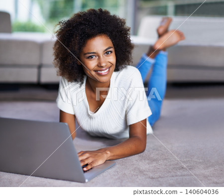 Carpet, laptop and portrait of woman on floor working on freelance creative project in living room. Happy, technology and African female designer typing on computer for research on rug in apartment. Carpet, laptop and portrait of woman on floor working on freelance creative project in living room. Happy, technology and African female designer typing on computer for research on rug in apartment. 140604036