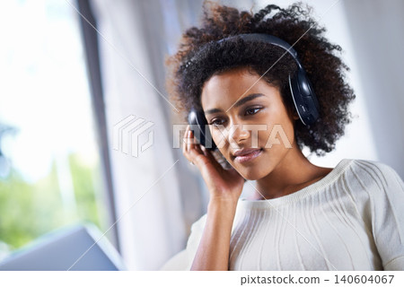 Headphones, woman and laptop with web, home and technology for video and music. African student, computer and internet for streaming, blog and email with connectivity and relax for wellness in house Headphones, woman and laptop with web, home and technology for video and music. African student, computer and internet for streaming, blog and email with connectivity and relax for wellness in house 140604067