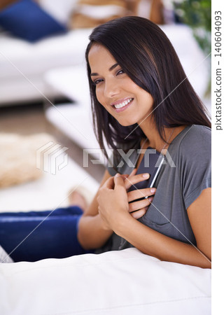 Portrait, smile and woman on a. sofa with phone for social media, search or online dating communication at home. Happy, face and female person in living room with smartphone app for google it or chat Portrait, smile and woman on a. sofa with phone for social media, search or online dating communication at home. Happy, face and female person in living room with smartphone app for google it or chat 140604093