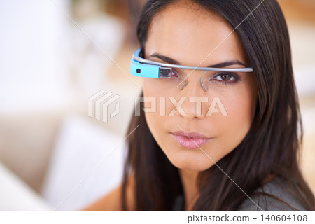 Woman, portrait and serious with smart glasses in home for virtual reality, high tech information and digital eyewear. VR, person and futuristic vision for communication, research and mockup in house Woman, portrait and serious with smart glasses in home for virtual reality, high tech information and digital eyewear. VR, person and futuristic vision for communication, research and mockup in house 140604108