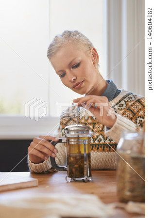 Woman, happy and herbal tea to relax in home and warm beverage of herbs mixture for health. Calm, designer and creative idea with dried leaves in plunger and wellness for detox drink in mason jar 140604182