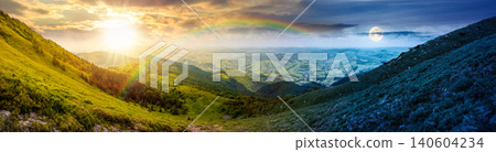 panorama of mountainous landscape. day meet night. wide view of cloudy sky with sun and moon in harmony over the grassy slope of a mountain ridge. epic summer solstice. adventure tourism in highland panorama of mountainous landscape. day meet night. wide view of cloudy sky with sun and moon in harmony over the grassy slope of a mountain ridge. epic summer solstice. adventure tourism in highland 140604234