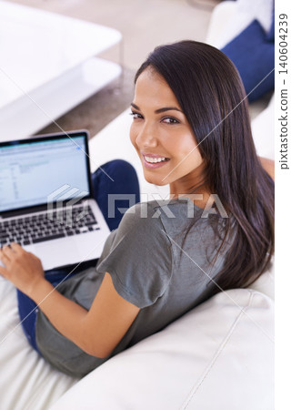 Laptop screen, remote work and woman portrait on sofa for streaming, planning or research at home. Freelance, face and female writer with pc display for editing, search or writing digital newspaper 140604239