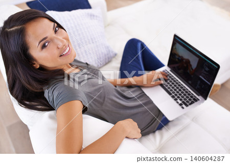 Laptop screen, portrait and happy woman on sofa for social media, blog or web communication at home. Pc, mockup or face of female person a living room for movie search, google it or Netflix and chill 140604287