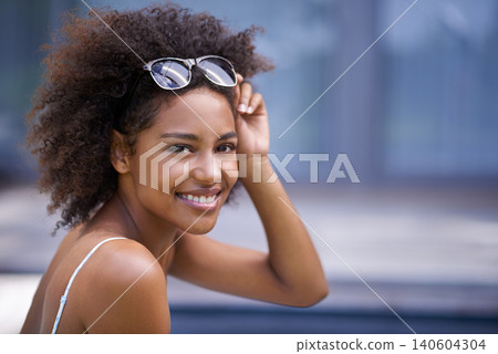 Black woman, portrait and sunglasses by swimming pool for summer, holiday and vacation. Happy face of a young person or USA model with shades and outdoor for luxury, style and accessory in confidence Black woman, portrait and sunglasses by swimming pool for summer, holiday and vacation. Happy face of a young person or USA model with shades and outdoor for luxury, style and accessory in confidence 140604304