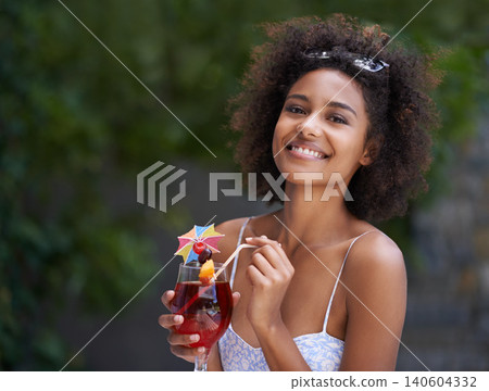 African, woman and portrait with cocktail and summer or vacation, relax or happy for wellness at resort. Holiday, tropical retreat or natural black female person, fruit liquid for drinking in nature African, woman and portrait with cocktail and summer or vacation, relax or happy for wellness at resort. Holiday, tropical retreat or natural black female person, fruit liquid for drinking in nature 140604332