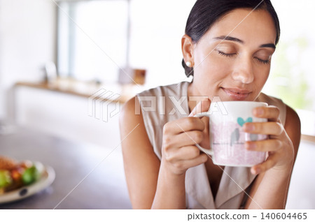 Woman, relax and smell coffee on kitchen or morning, enjoying and holding mug or cup. Female person, drinking tea or expresso for breakfast or energy at home, eyes closed and smile indoors or house 140604465