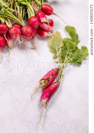 Fresh and decaying radishes highlighting food waste concept Fresh and decaying radishes highlighting food waste concept 140605075