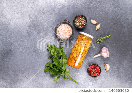 Pickled honey mushrooms in jar with spices and herbs Pickled honey mushrooms in jar with spices and herbs 140605080
