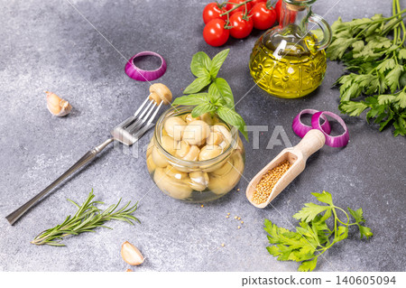 Pickled mushrooms with ingredients for preparing mediterranean appetizer Pickled mushrooms with ingredients for preparing mediterranean appetizer 140605094
