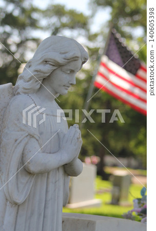 Old Angel Statue With American Flag in Background Rural East Texas Cemetery Old Angel Statue With American Flag in Background Rural East Texas Cemetery 140605398