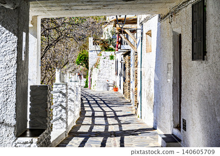 Pampaneira, in the Alpujarra region of Granada, with its narrow, steep streets and water channels running through them 140605709
