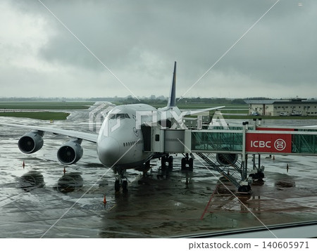 Buenos Aires, Argentina - April 21, 2026: Passenger aircraft on wet apron at Ezeiza International Airport Buenos Aires, Argentina - April 21, 2026: Passenger aircraft on wet apron at Ezeiza International Airport 140605971