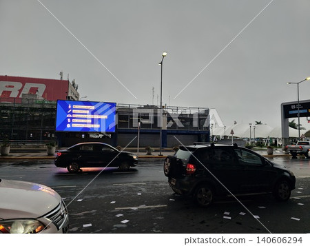 Buenos Aires, Argentina - April 21, 2026: Airport terminal exterior with travel services advertising Buenos Aires, Argentina - April 21, 2026: Airport terminal exterior with travel services advertising 140606294