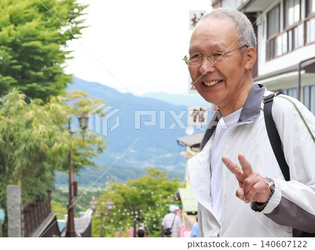 Senior men walking through the hot spring town Senior men walking through the hot spring town 140607122