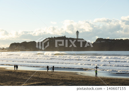 Shonan Kugenuma Beach: Morning view of Enoshima and the shore with waves. 140607155