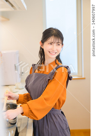 Japanese woman cooking in the kitchen Japanese woman cooking in the kitchen 140607997