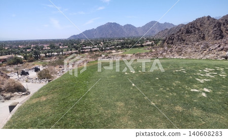 The breathtaking scenery of La Quinta Mountain Course. Desert plants spread out, and the city and mountains can be seen below. The breathtaking scenery of La Quinta Mountain Course. Desert plants spread out, and the city and mountains can be seen below. 140608283