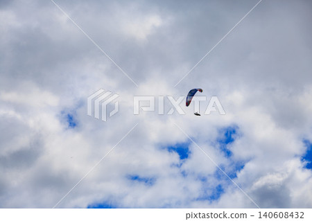 Paragliding flying in the sky Paragliding flying in the sky 140608432