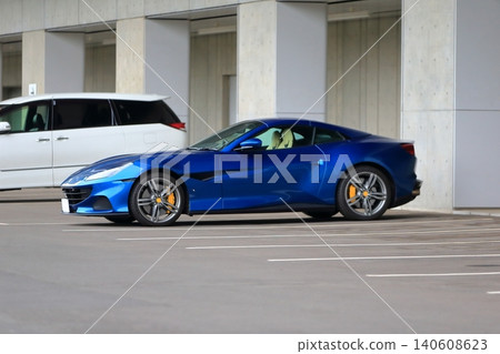 A blue Italian sports car A blue Italian sports car 140608623