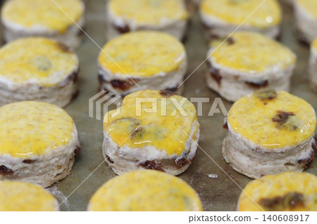 A row of raisin scones A row of raisin scones 140608917