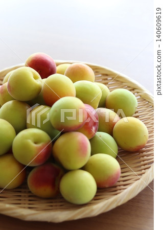 Plums in a colander Plums in a colander 140609619