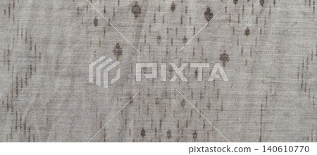 Neutral beige fabric texture with a subtle geometric pattern background. 140610770