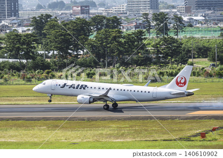 A sunny day at Sendai Airport, with an airplane taking off. Natori City, Miyagi Prefecture. A sunny day at Sendai Airport, with an airplane taking off. Natori City, Miyagi Prefecture. 140610902