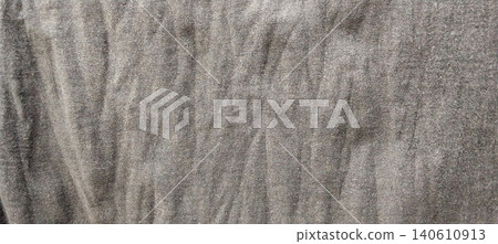 A close up of the texture of the grey linen fabric with natural creases creating an organic and authentic look. 140610913