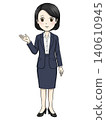 Full-body illustration of a female office worker giving directions. 140610945