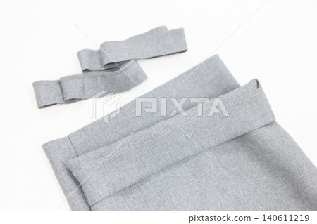 Trousers after hemming and cut scraps Trousers after hemming and cut scraps 140611219