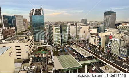 The skyline of buildings and the vast cityscape at Kawasaki Station's east exit is bathed in the evening light. The skyline of buildings and the vast cityscape at Kawasaki Station's east exit is bathed in the evening light. 140611616