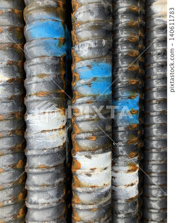 Close-up of deformed reinforcing bars with identification markings. Close-up of deformed reinforcing bars with identification markings. 140611783
