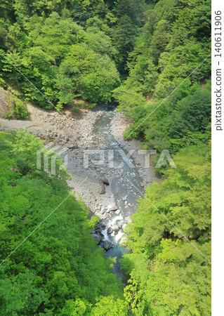 The bluish river scenery of Sumata Gorge in Shizuoka during the season of fresh greenery. The bluish river scenery of Sumata Gorge in Shizuoka during the season of fresh greenery. 140611906