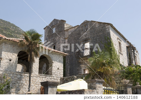 Perast, Montenegro - August 4, 2017: Building and construction on the embankment near the sea Perast, Montenegro - August 4, 2017: Building and construction on the embankment near the sea 140612188