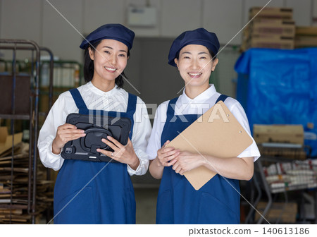 A female staff member in her 40s who manages inventory. A female staff member in her 40s who manages inventory. 140613186