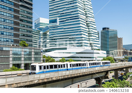 A train on the Wenhu or Brown Line of the Taipei MRT passes by the modern metropolis building in Nangang Software Park Area. A train on the Wenhu or Brown Line of the Taipei MRT passes by the modern metropolis building in Nangang Software Park Area. 140613238