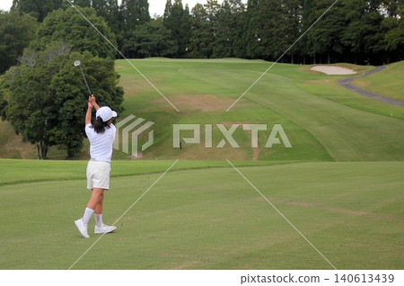 Young golfers playing golf Young golfers playing golf 140613439