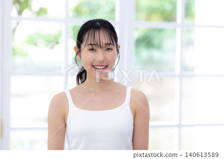Beauty skincare image: A woman smiling and looking at the camera. 140613589