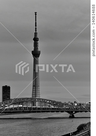 A monochrome view of Tokyo Skytree and the newly renovated Shirahige Bridge from the Sumida River Terrace. A monochrome view of Tokyo Skytree and the newly renovated Shirahige Bridge from the Sumida River Terrace. 140614688
