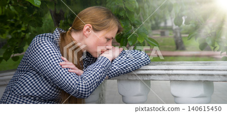 Sad girl in the park 140615450