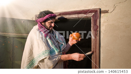 Man painting door with blood Man painting door with blood 140615453